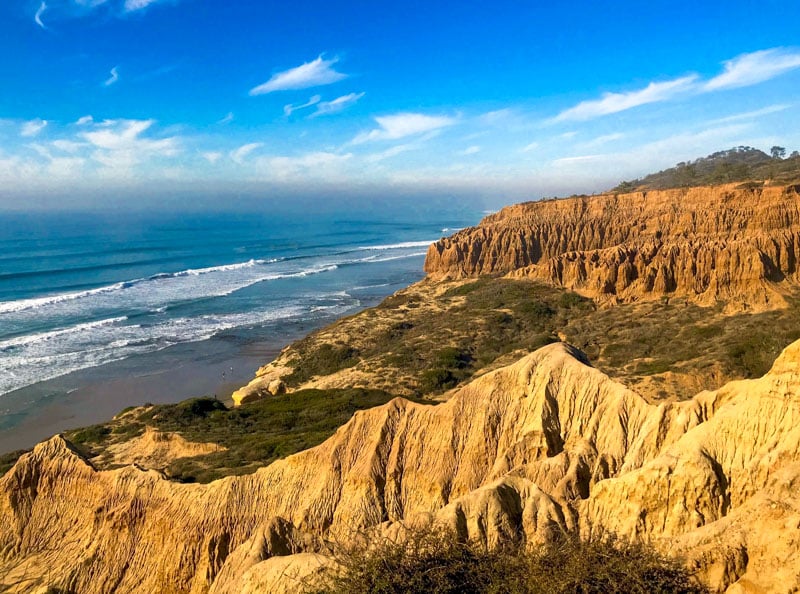 Relax and surf amidst the natural beauty of Torrey Pines, Del Mar.